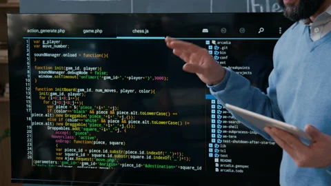 Anonymous Male Programming Teacher Explaining Algorithm on Multimedia Screen Stock-Footage 306979754