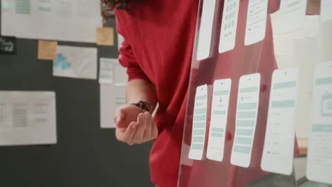 Anonymous Male UI Developer Presenting Wireframe Designs at Team Meeting Stock Footage 327907102