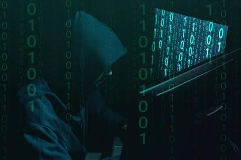 Anonymous man with computers and binary code in darkness Stock Photos