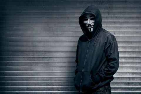 Anonymous man on grey shutter door Stock Photos