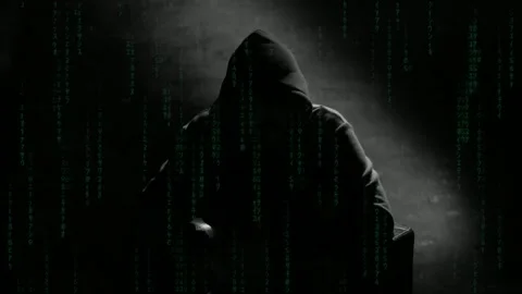 Anonymous man in a hood interview video footage. Mysterious man sitting on .. Stock Footage 272443537