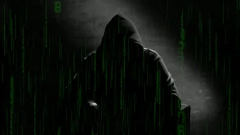 Anonymous man in a hood interview video footage. Mysterious man sitting on .. Stock Footage 272443543
