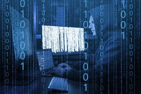 Anonymous man in mask with computers and binary code in darkness 库存照片