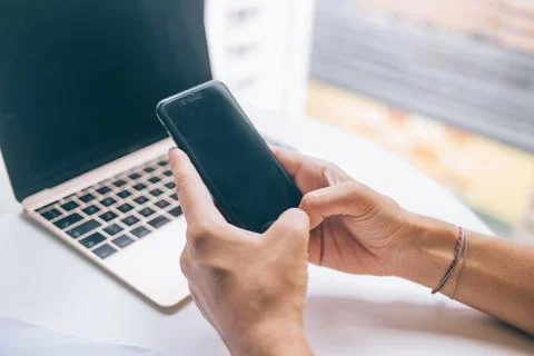Anonymous man messaging on smartphone Stock Photos