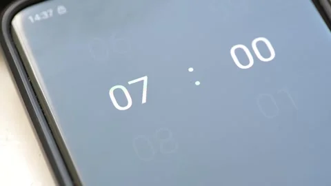 Anonymous man setting an alarm clock on his smartphone, mobile phone, 7 AM... Stock Footage 245744629