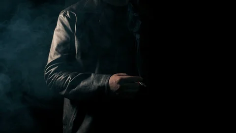 Anonymous Man Smoking In The Dark Stock Footage 119392713