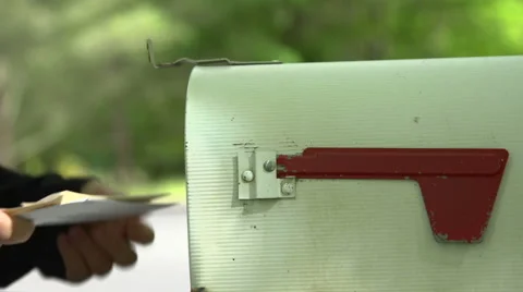 An anonymous man takes post from mailbox Stock Footage 44115469