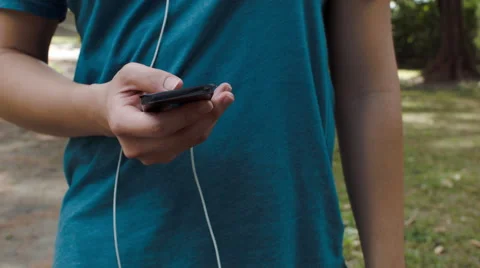 Anonymous man texting on mobile phone outdoors Stock Footage 53082037