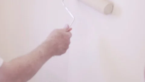 Anonymous Man Uses Paint Roller On Wall Stock Footage 88013789