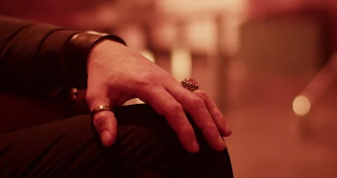 Anonymous man wearing ring resting at home Stock Footage 260558187