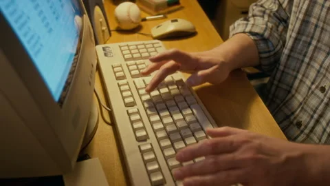 Anonymous Man Working on Spreadsheet on 1990s Computer Stock Footage 327233936