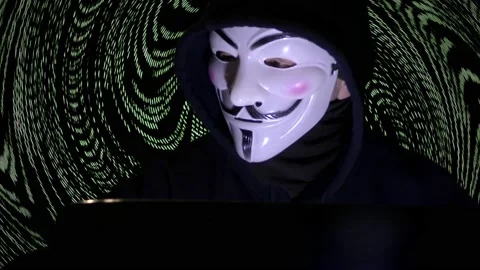 Anonymous mask and coding -Hacker in the hood with anonymous mask. Stock Footage 167367896