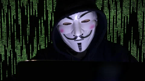 Anonymous mask and coding -Hacker in the hood with anonymous mask. Stock Footage 167367912