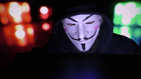 Anonymous mask and coding -Hacker in the hood with anonymous mask. Stock Footage 167367919