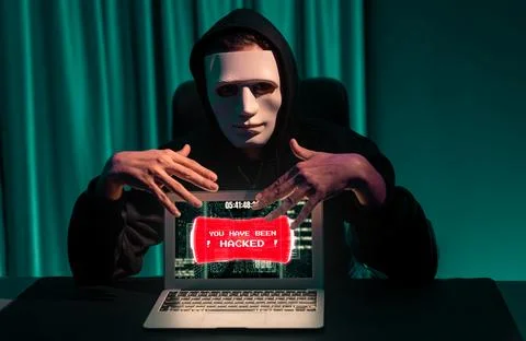 Anonymous mask successful making password encryption hack on laptop. Pecuniary. 写真素材