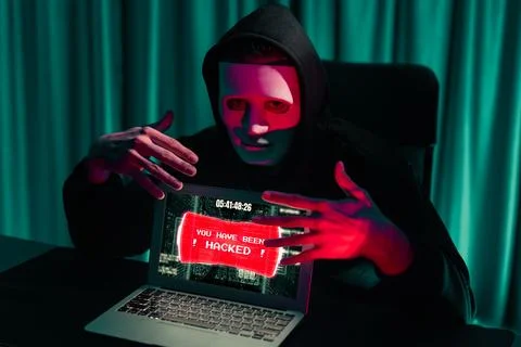 Anonymous mask successful making password encryption hack on laptop. Pecuniary. 写真素材