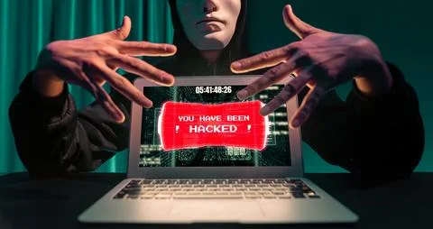 Anonymous mask successful making password encryption hack on laptop. Pecuniary. 写真素材