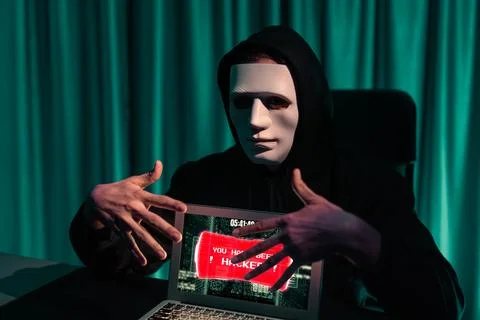 Anonymous mask successful making password encryption hack on laptop. Pecuniary. 写真素材