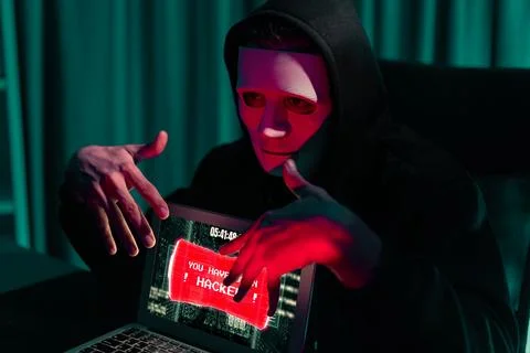 Anonymous mask successful making password encryption hack on laptop. Pecuniary. 写真素材