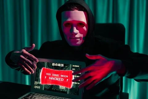 Anonymous mask successful making password encryption hack on laptop. Pecuniary. 写真素材