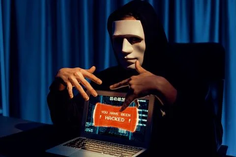 Anonymous mask successful making password encryption hack on laptop. Pecuniary. 写真素材