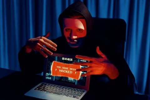 Anonymous mask successful making password encryption hack on laptop. Pecuniary. 写真素材