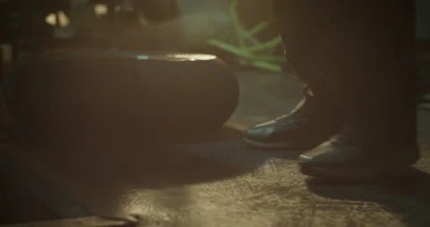 Anonymous mechanic taking new wheel from floor Stock Footage 265008295