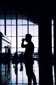 An anonymous men looking for information screen in an airport Foto stock
