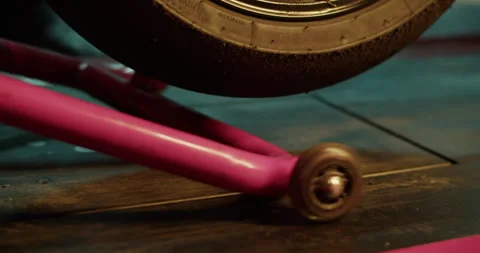 Anonymous motorcyclist lifting wheel with adjustable jack Stock Footage 265008226