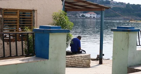 Anonymous old man by the sea Video stock 118823195