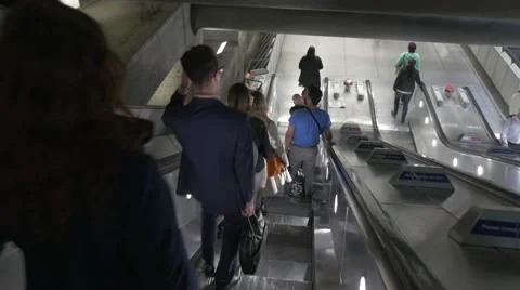 Anonymous people on escalator Stock Footage 49469599