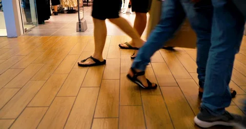 Anonymous people passing by in shopping mall Stock Footage 130064626