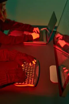 Anonymous people using computer and programming to break code. Cyber securi.. 스톡 사진