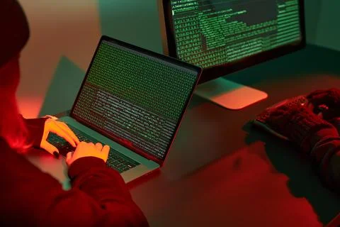Anonymous people using computer and programming to break code. Cyber securi.. Foto stock