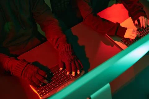 Anonymous people using computer and programming to break code. Cyber securi.. Foto stock