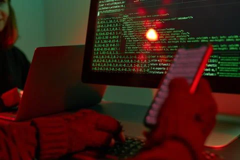 Anonymous people using computer and programming to break code. Cyber securi.. Foto stock