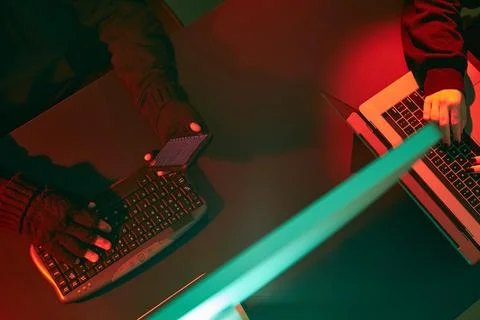 Anonymous people using computer and programming to break code. Cyber securi.. Foto stock