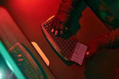 Anonymous people using computer and programming to break code. Cyber securi.. Stock Photos