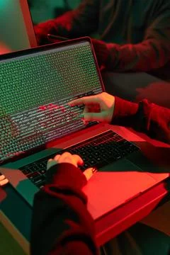 Anonymous people using computer and programming to break code. Cyber securi.. Foto stock