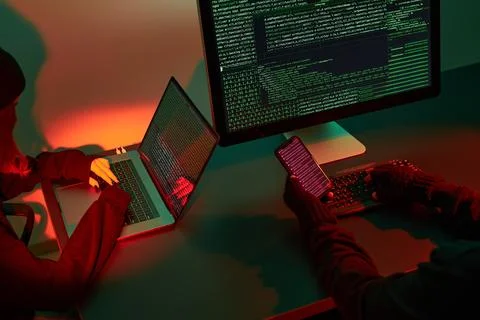 Anonymous people using computer and programming to break code. Cyber securi.. 库存照片