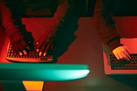 Anonymous people using computer and programming to break code. Cyber secur... 스톡 사진