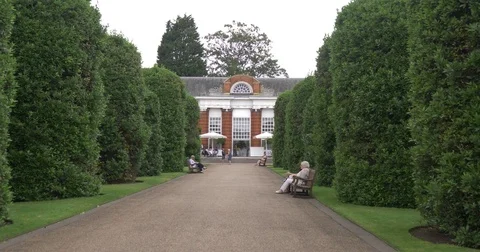 Anonymous people walking british park relaxed holidays tourist typical palace  Stock Footage 80456517