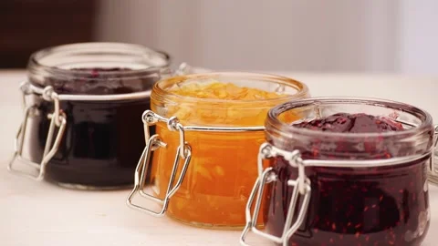 Anonymous person choosing raspberry jam Stock Footage 136672151