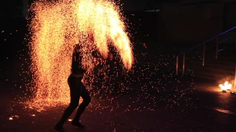 Anonymous person dancing with fire at night Stock Footage 144213741