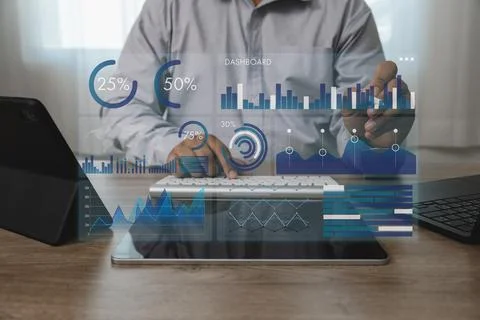 Anonymous person points at digital dashboard overlay with charts, graphs, p.. Stock Photos