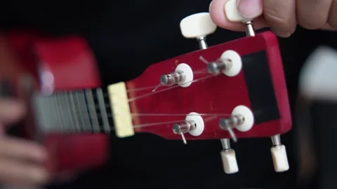 Anonymous person singing while playing ukulele Video stock 293534606