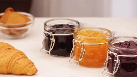 Anonymous person taking berry jam from jar Stock Footage 136672011