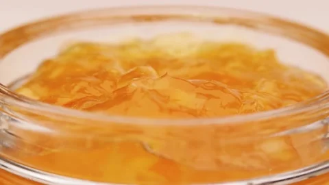Anonymous person taking jam from jar Stock Footage 136672391
