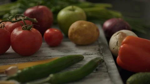 Anonymous person taking tomatoes from table Stock Footage 119974635