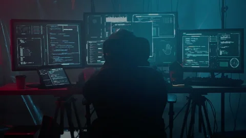 Anonymous person using omputer system for hacker attack Stock Footage 257382875